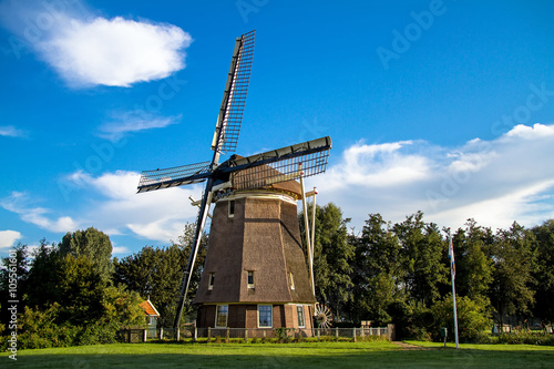Traditional dutch windmill near the lake in Amsterdam,Netherlands 