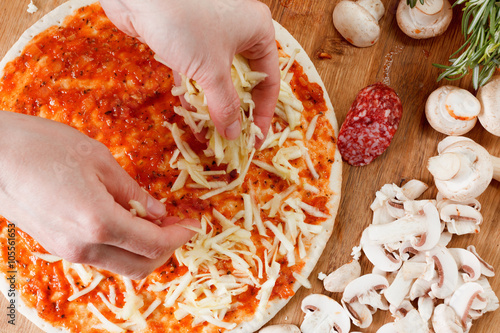 Cooking homemade pizza with...