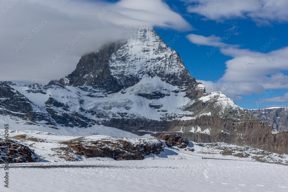 Fototapeta premium Amazing landscape of matterhorn peak covered with clods, Alps, Switzerland