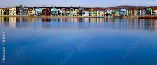 The blue lake of Sparks Marina against the backdrop of colorful houses. photo