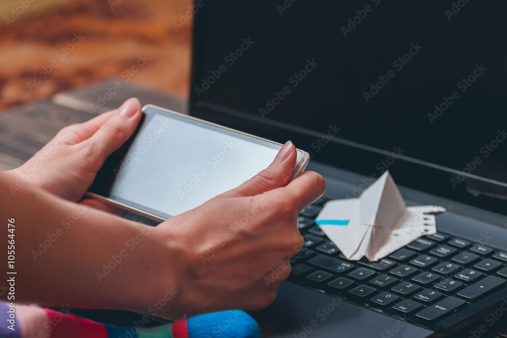 Female hands holding smartphone Female hands holding smartphone