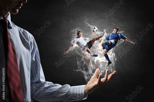 Soccer players fighting for ball
