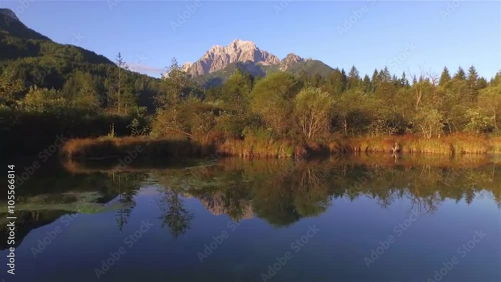 AERIAL: Flying over beautiful lake towards the big mountains AERIAL: Flying over beautiful lake towards the big mountains