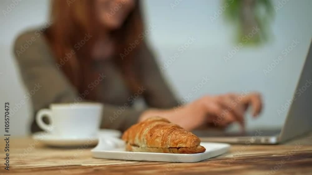 Woman driking coffee and working in coffeeshop. Slow motion Woman driking coffee and working in coffeeshop. Slow motion