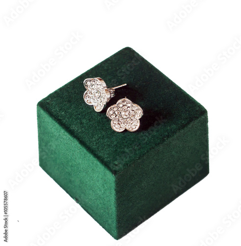 earrings on green box