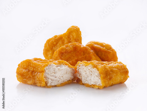Fried chicken nuggets isolated on white photo