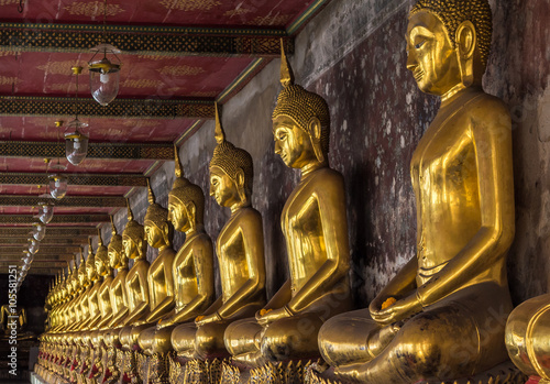 Golden buddhas in Wat Suthat, Bangkok photo