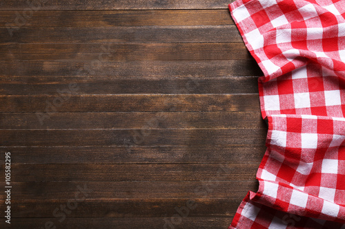 Checkered napkin on wooden background