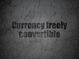 Currency concept: Currency freely Convertible on grunge wall background