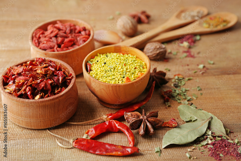 Assorted spices on wooden table closeup Assorted spices on wooden table closeup