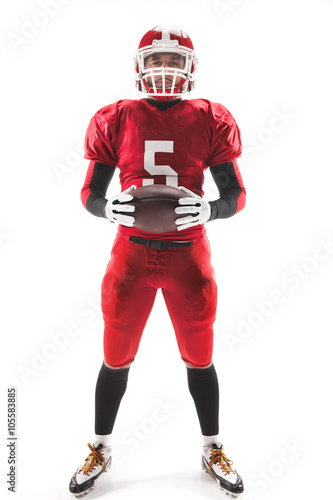 American football player posing with ball on white background