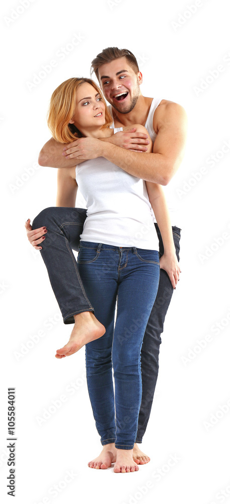 Young couple in love having fun together, isolated on white Young couple in love having fun together, isolated on white