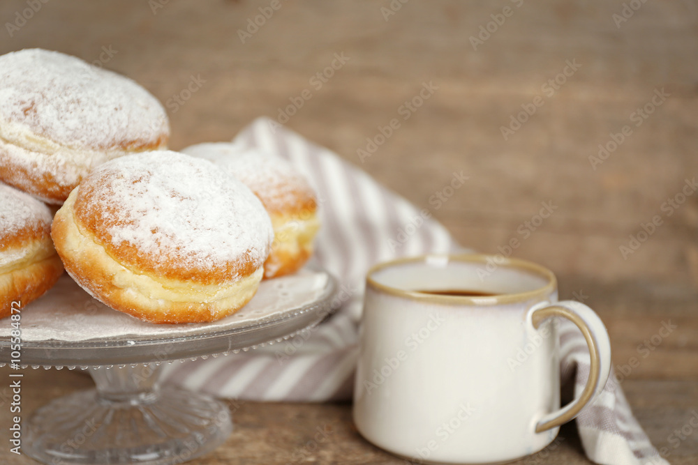 Delicious sugary donuts on wooden table closeup Delicious sugary donuts on wooden table closeup