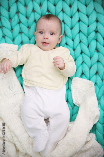 Lovely baby with white plai...