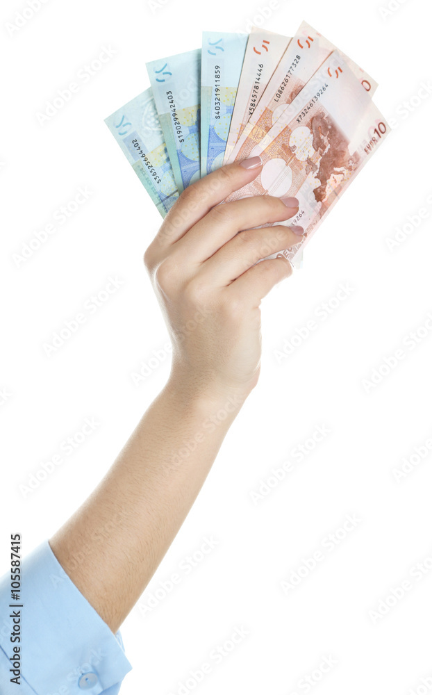Female hand with money isolated on white Female hand with money isolated on white