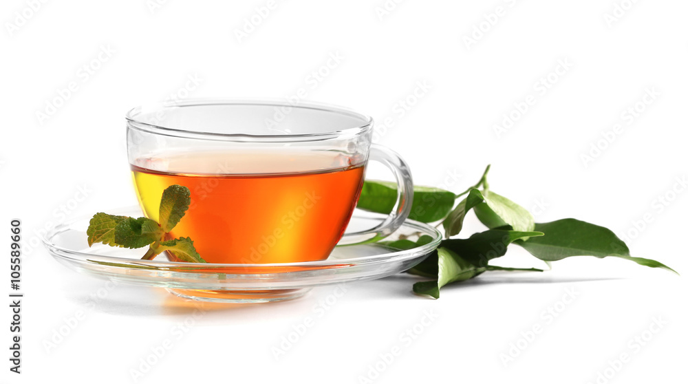 Cup of tea and tea leaves isolated on white Cup of tea and tea leaves isolated on white
