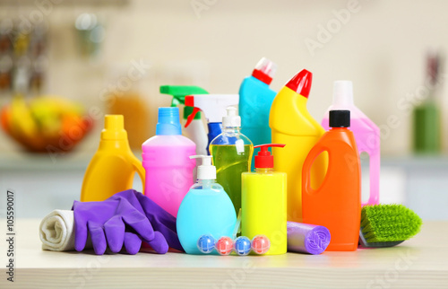 Cleaning set with products and tools on kitchen table