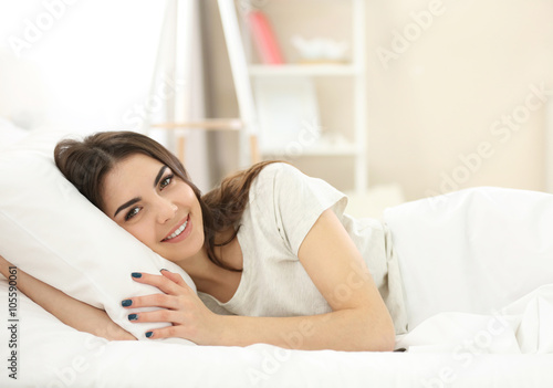 Beautiful young girl lying ...