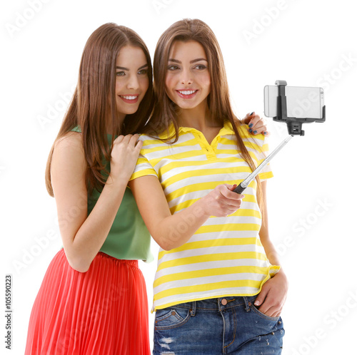 Two teenager girls making p...