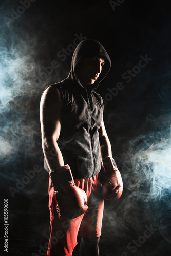 The young man kickboxing 
