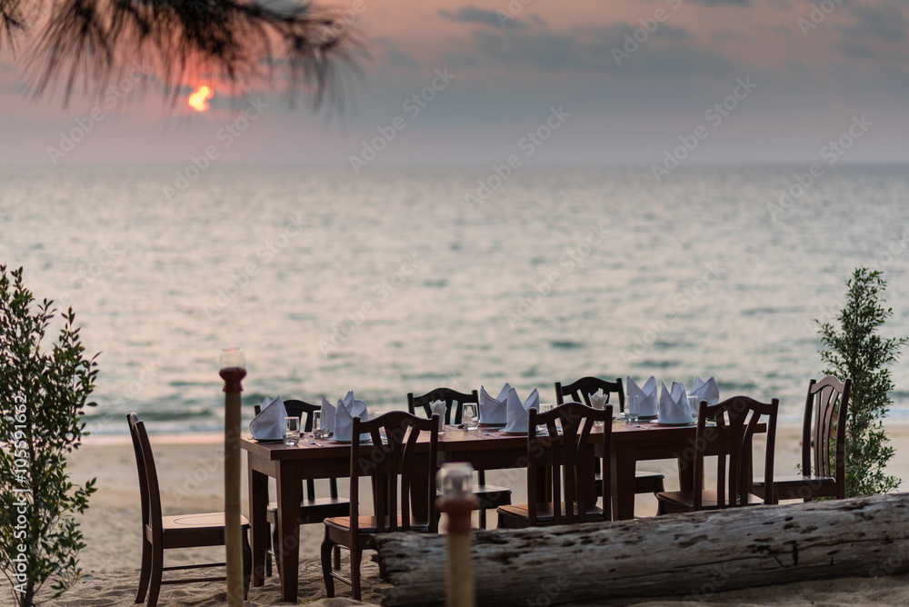 Fototapeta premium Dinner table set on the beach