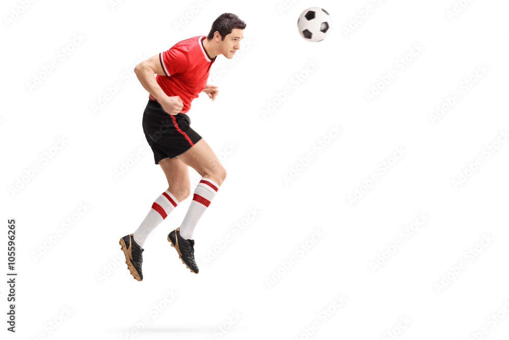 Fototapeta premium Male football player heading a ball