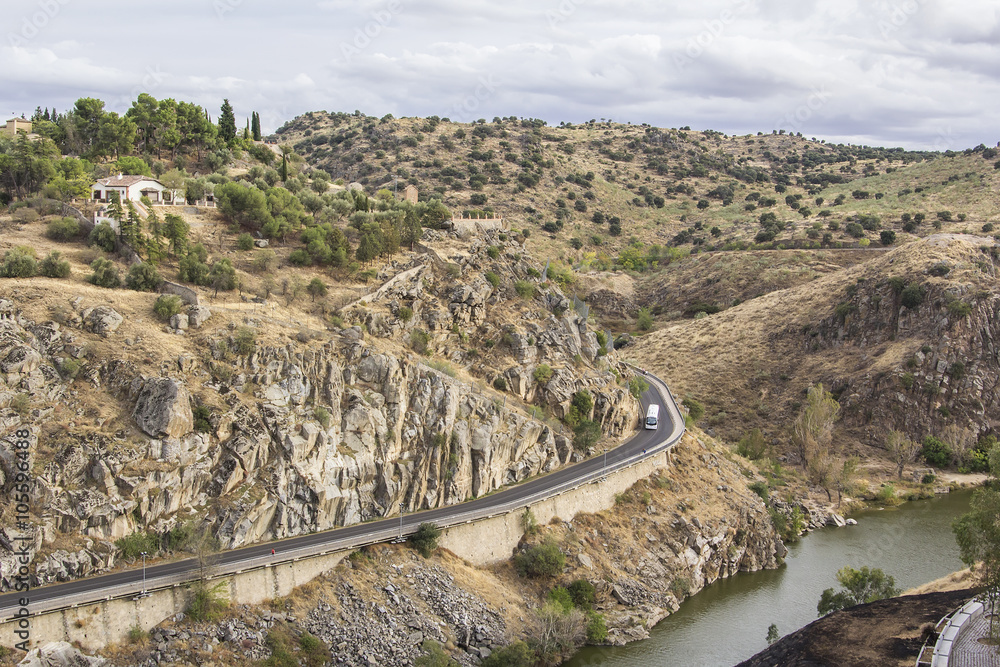 background landscape view of the hills, the road and the river Tagus at Toledo walls, Castilla-La Mancha, Spain