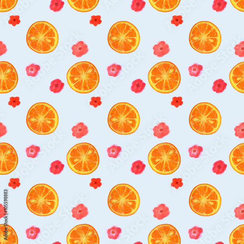 Seamless pattern with watercolor flowers and slices of orange