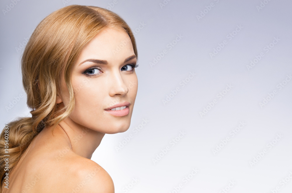 Fototapeta premium Beautiful young woman, on grey