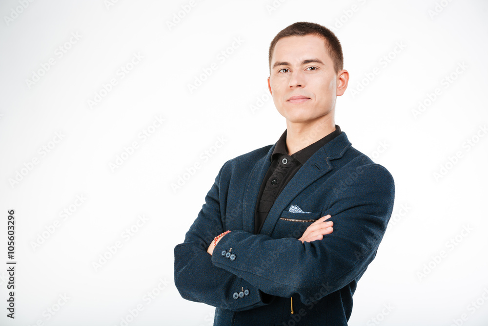 Confident businessman standing with arms folded Confident businessman standing with arms folded