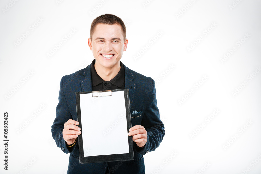 Smiling businessman holding blank clipboard Smiling businessman holding blank clipboard