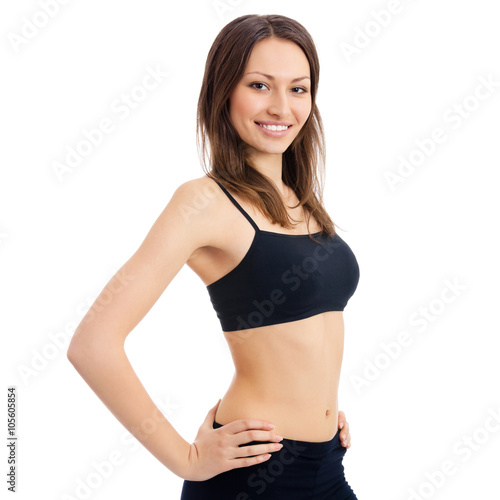 Smiling woman in fitness wear, isolated