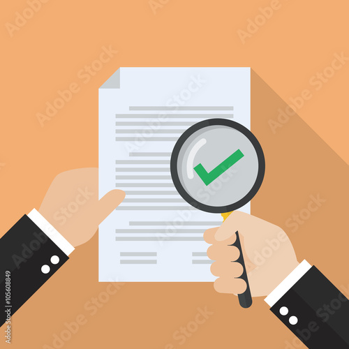 Hand holding magnifying glass with document paper approved
