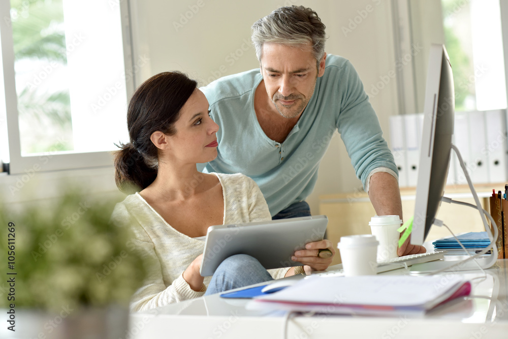 Business team working together in office Business team working together in office