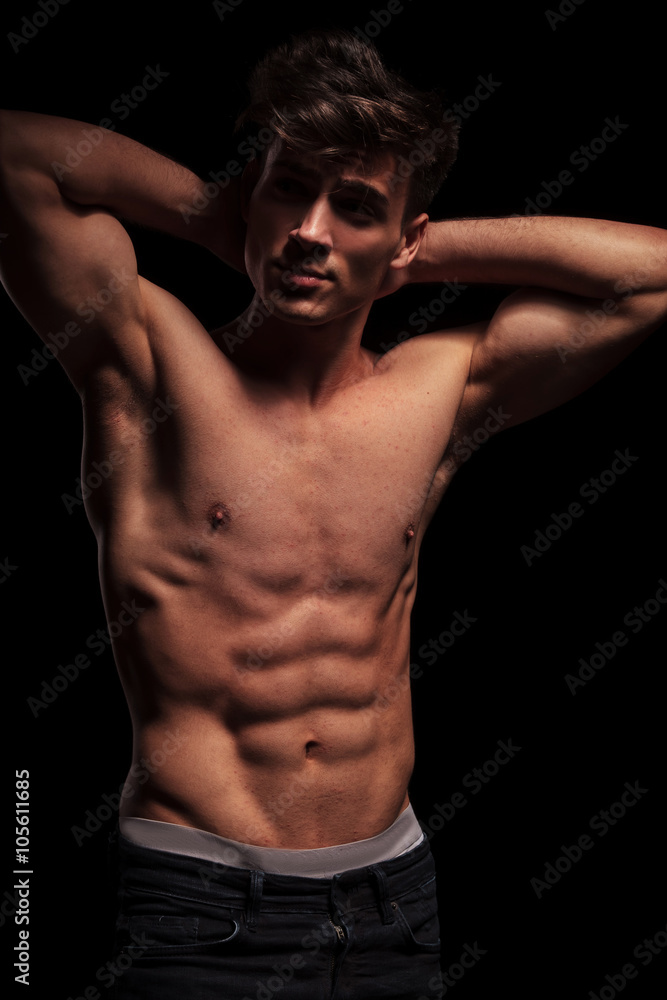 Fototapeta premium muscular topless man flexing his arms