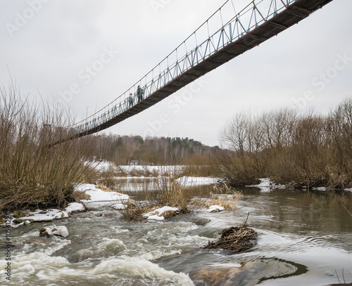 Hanging bridge over Ugra river at Tovarkovo. Kaluga region, Russia photo