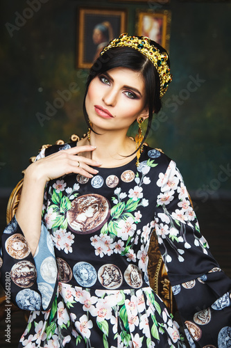 Portrait of beautiful elegant woman in gorgeous fashion dress with evening make-up and hair style