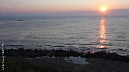 Evening sea smooth video panorama with setting sun and suntrack on water surface.
 photo