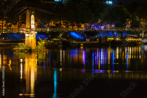 Bridge over Rhone river in Lyon, France at night