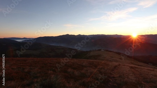 Wallpaper Mural The first rays of rising sun in autumn Carpathian Mountains. Video has view of rural road on ridge, mountain tops and mist between the mountain slopes. There is some sun flare effect.         
 Torontodigital.ca