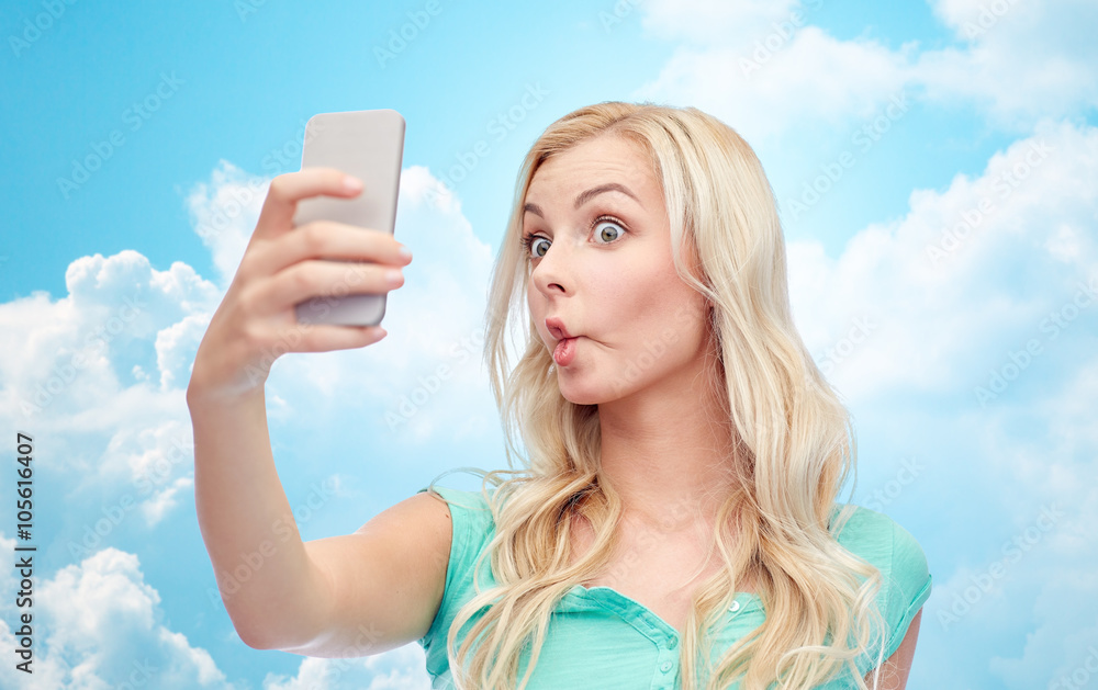 funny young woman taking selfie with smartphone funny young woman taking selfie with smartphone