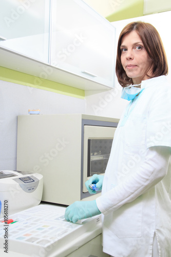 Dentist female doctor in office working