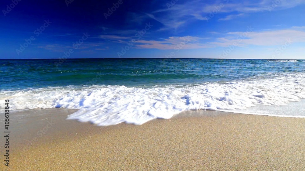 Blue sky and ocean waves on the beach Blue sky and ocean waves on the beach