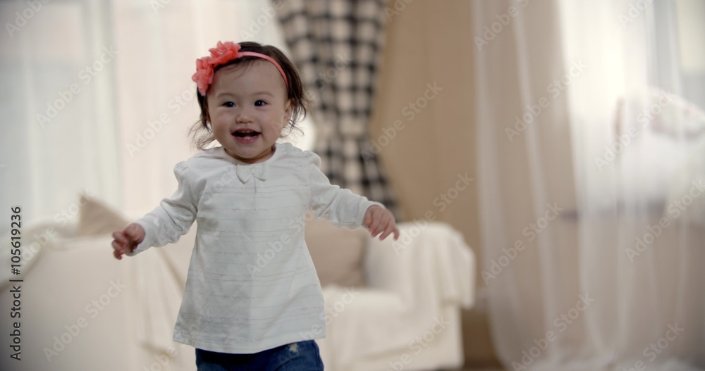 little girl Asian baby taking its first steps, the emotions of happiness, slow motion little girl Asian baby taking its first steps, the emotions of happiness, slow motion
