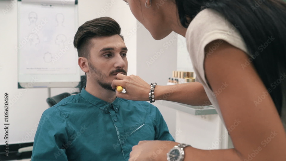 Model is geting ready fow photoset by stylist at the barber shop, slow motion Model is geting ready fow photoset by stylist at the barber shop, slow motion