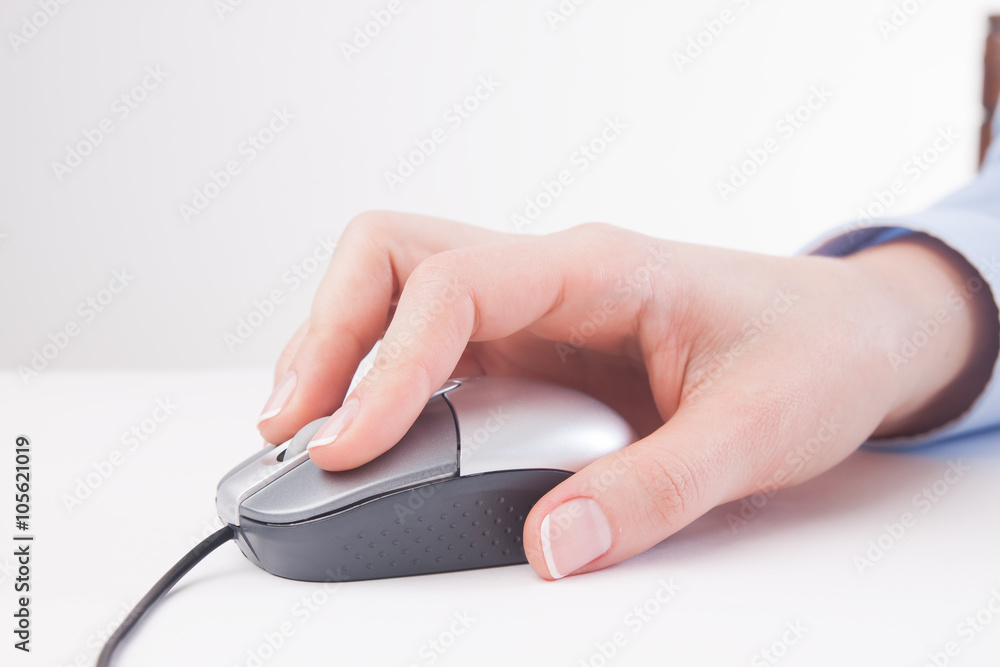 young woman using a mouse at office young woman using a mouse at office