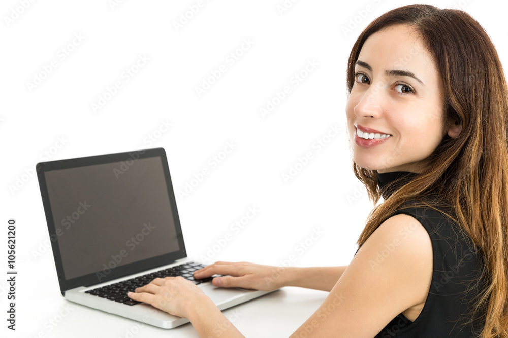 Attractive woman working on her laptop Attractive woman working on her laptop