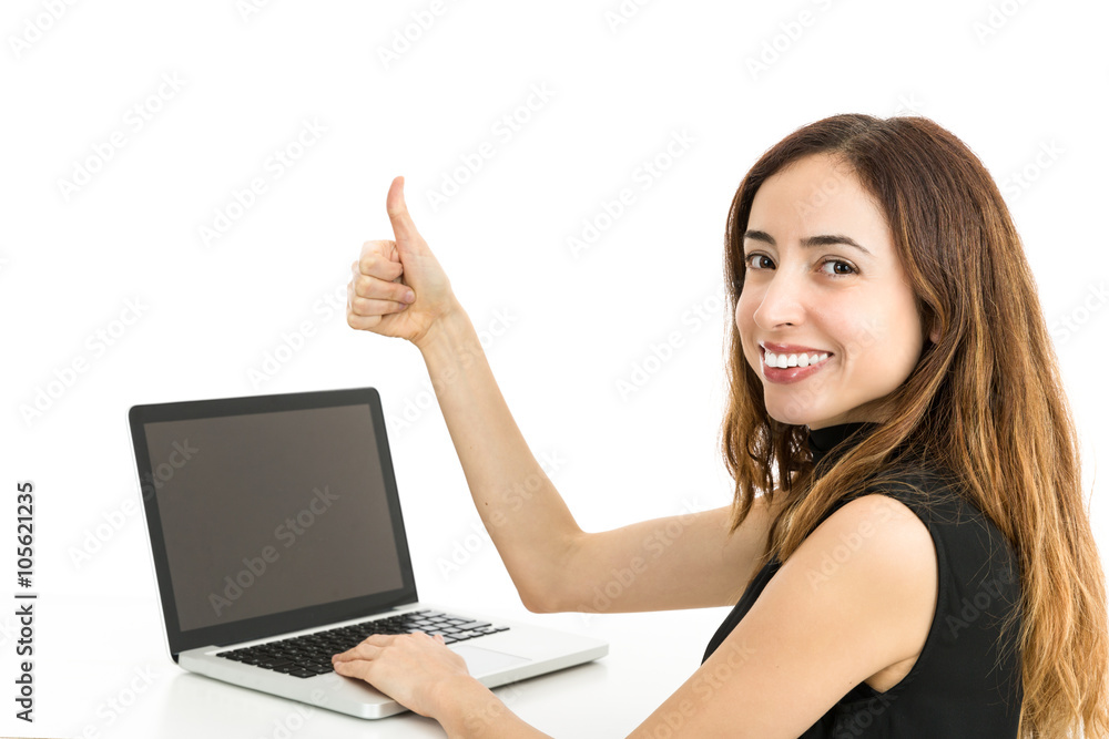 Woman with a laptop giving thumbs up Woman with a laptop giving thumbs up