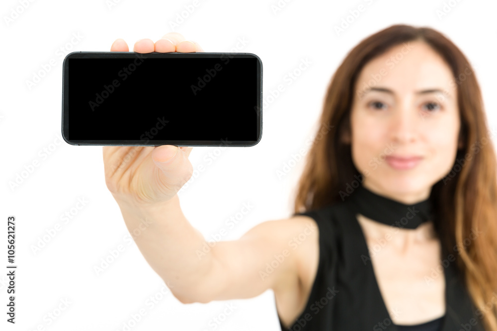 Woman showing smart phone with copy space