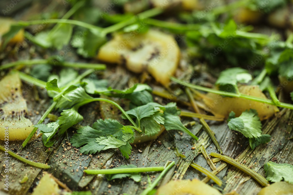 Fried leek with slices of kiwi and coriander leaves Fried leek with slices of kiwi and coriander leaves